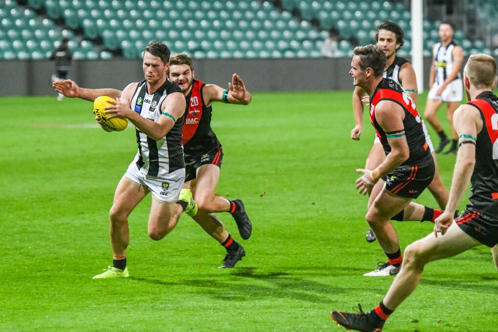 FLASHBACK: Rhys Mott in action for Glenorchy against North Launceston in the TSL. Mott will return to Ulverstone if a 2020 NWFL season is held. Picture: Paul Scambler