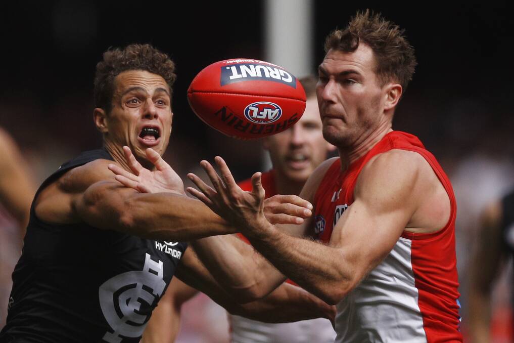 NEW SWAN: Ed Curnow and Jackson Thurlow action during Thurlow's debut for Sydney on Saturday at Marvel Stadium. Picture: AAP Image/Daniel Pockett