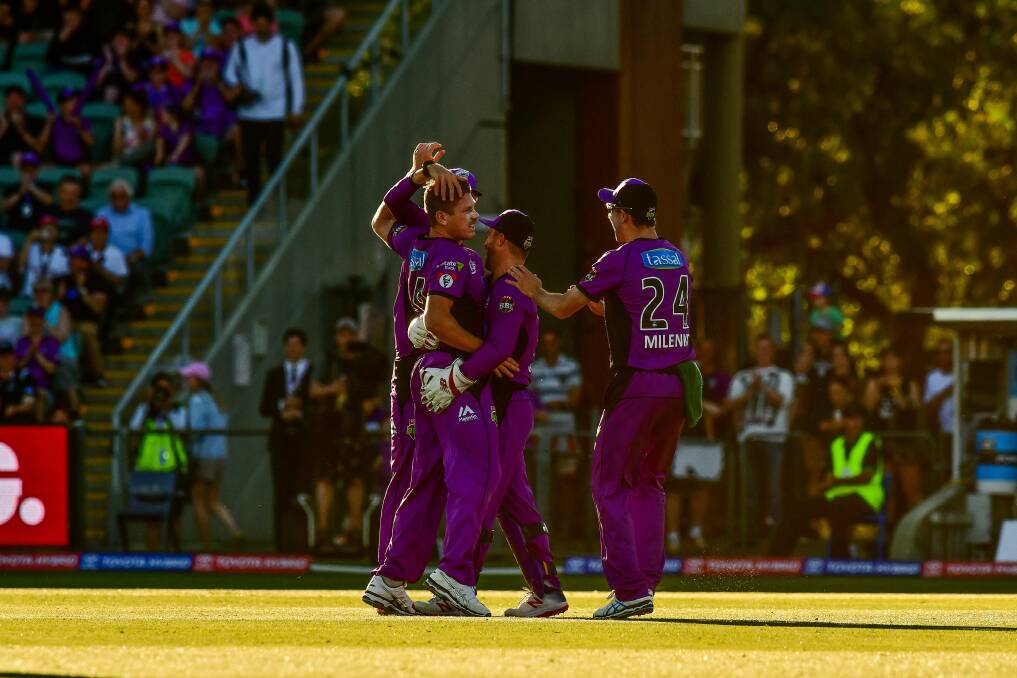 BIG START: James Faulkner and his Hobart Hurricanes teammates celebrate Faulkner's wicket from the first ball of the match. Picture: Scott Gelston