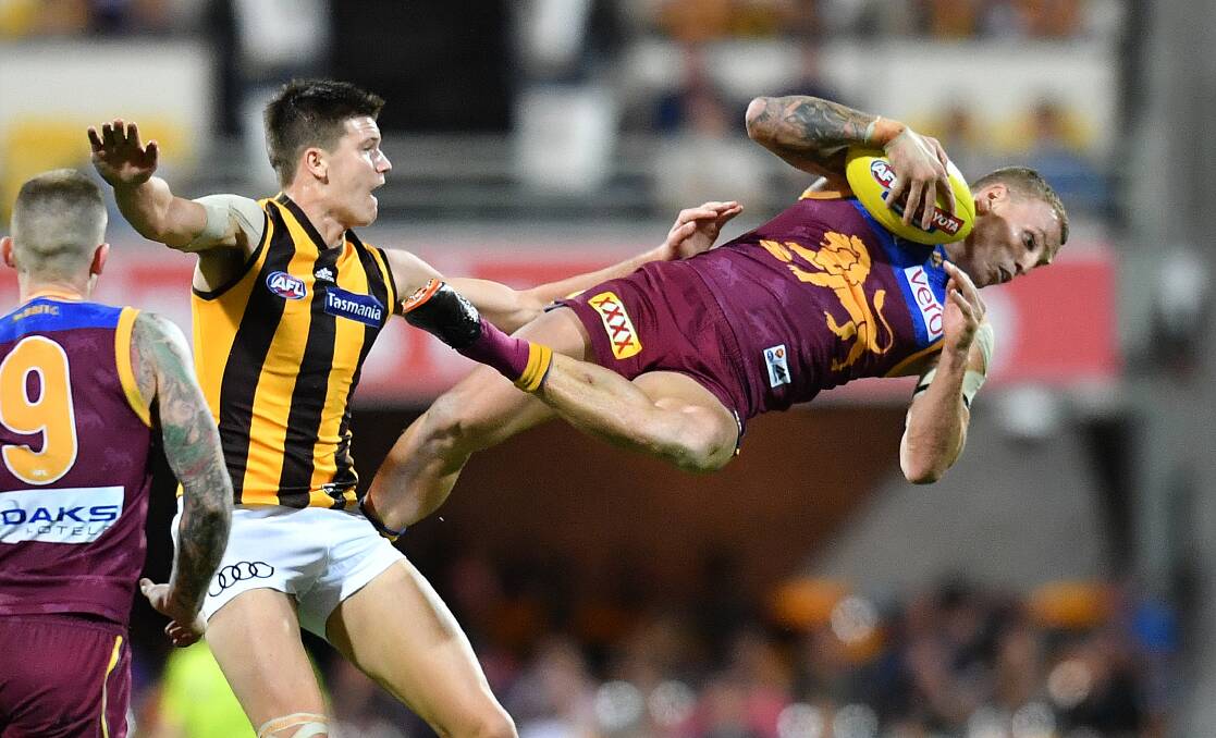 Mitch Robinson takes a strong mark against Hawthorn. Picture: AAP Image/Darren England