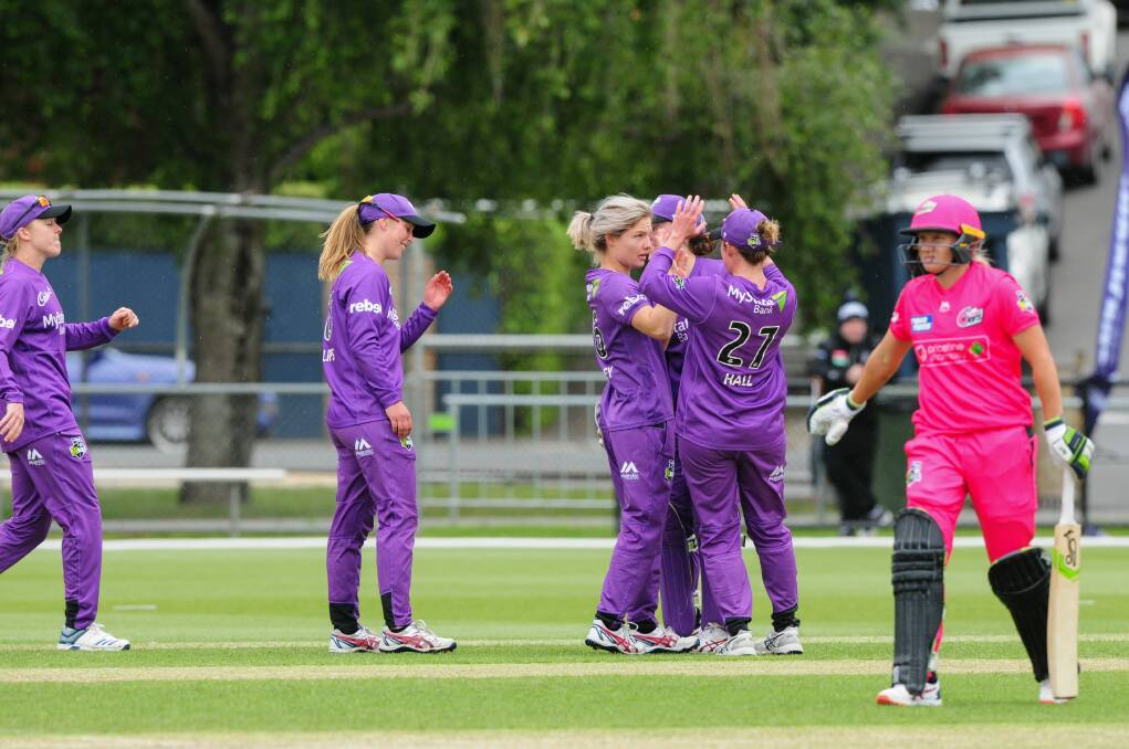 GOOD TIMES: The Hurricanes celebrate the wicket of Alyssa Healy last summer. Picture: Paul Scambler 