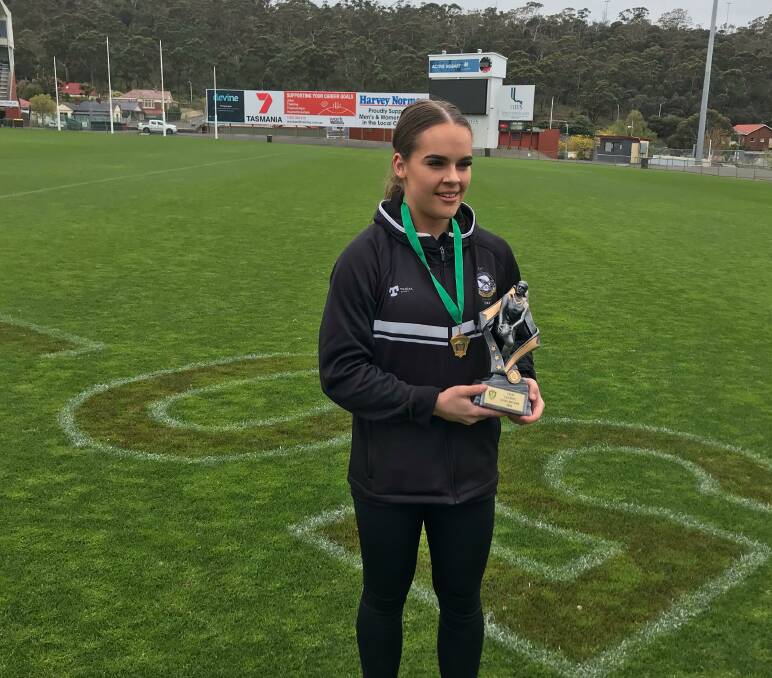 SIMPLY THE BEST: Sarah Skinner receiving the TSLW best and fairest award for this season on Friday. Picture: AFL Tasmania