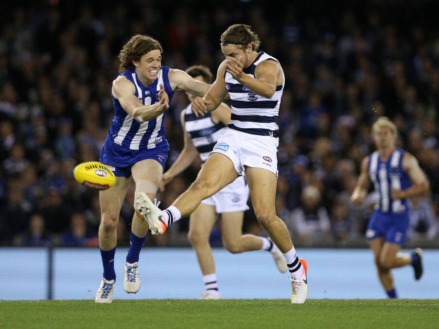 TASSIE TUSSLE: Ben Brown puts pressure on Jake Kolodjashnij in North Melbourne's loss to Geelong on Sunday. Brown kicked 5.0 to jump to second on the Coleman Medal table. Picture: AAP Image/Hamish Blair