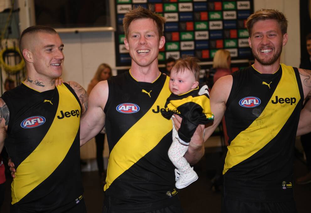HAPPY TIGER: Jack Riewoldt with his daughter Poppy after Saturday's win over Port Adelaide. Picture: AAP Image/Julian Smith