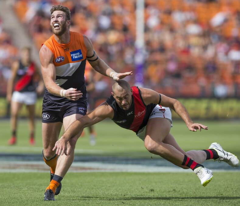 Thomas Bellchambers loses his footing against Dawson Simpson in the ruck on Sunday. Picture: AAP Image/Craig Golding