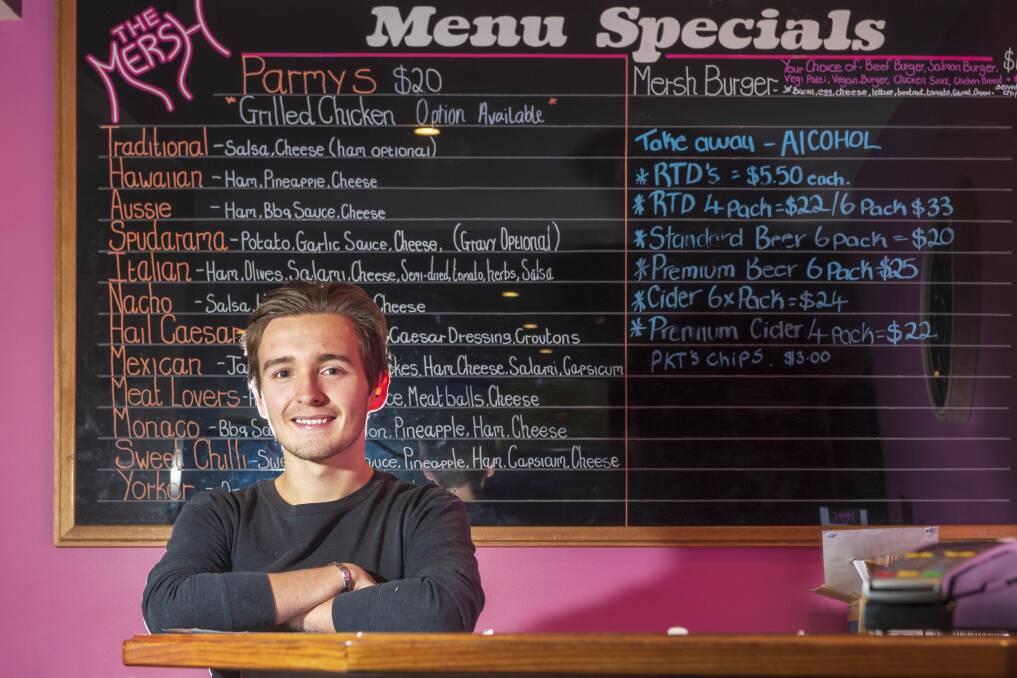 OPTIONS: 'The Mersh' bartender Brady Cowley could be pouring drinks again soon. Picture: Phillip Biggs.