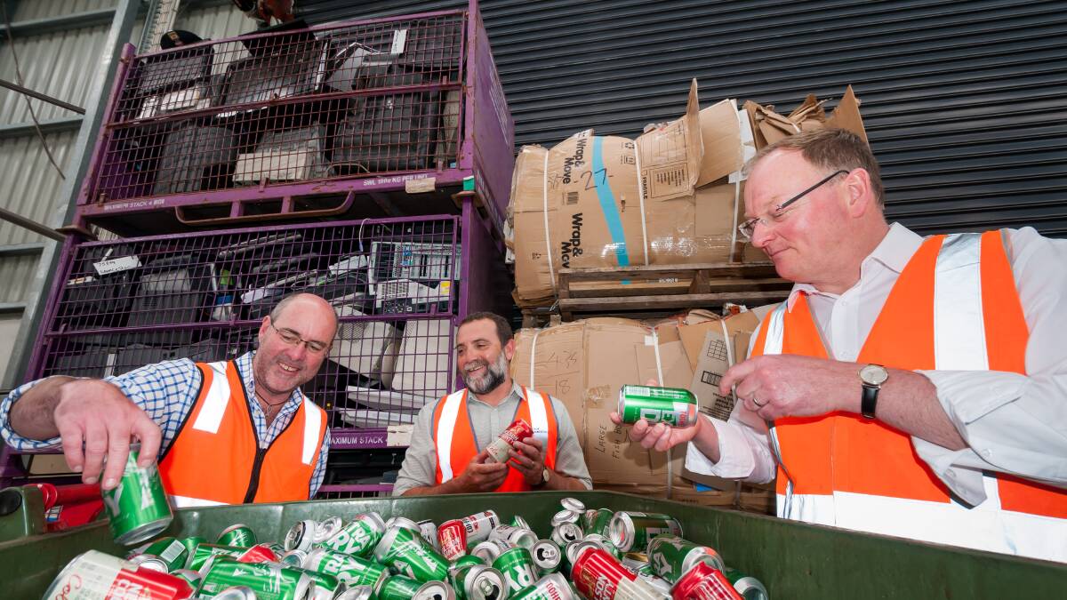 SCHEME: Charitable Recycling Australia Tasmanian director Peter Freak, City of Launceston sustainability team leader Mike Attard and Environment Minister Roger Jaensch discuss the container deposit scheme. Picture: Phillip Biggs