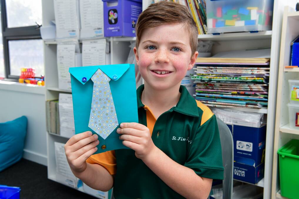 Thomas Penney with the card he made for his dad. Picture: Neil Richardson
