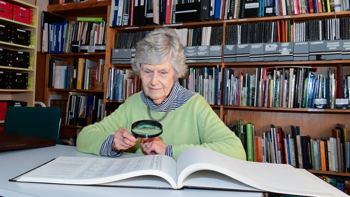 RESEARCH: Tasmanian Family History Society Launceston branch president Helen Stuart examining records at their library. Picture: Neil Richardson
