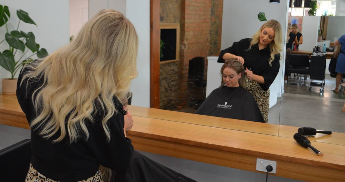 HONOURED: bob Hair on Tamar owner Jessie ODonoghue working on Leah Algodzkia's hair. Picture: Jackson Worthington
