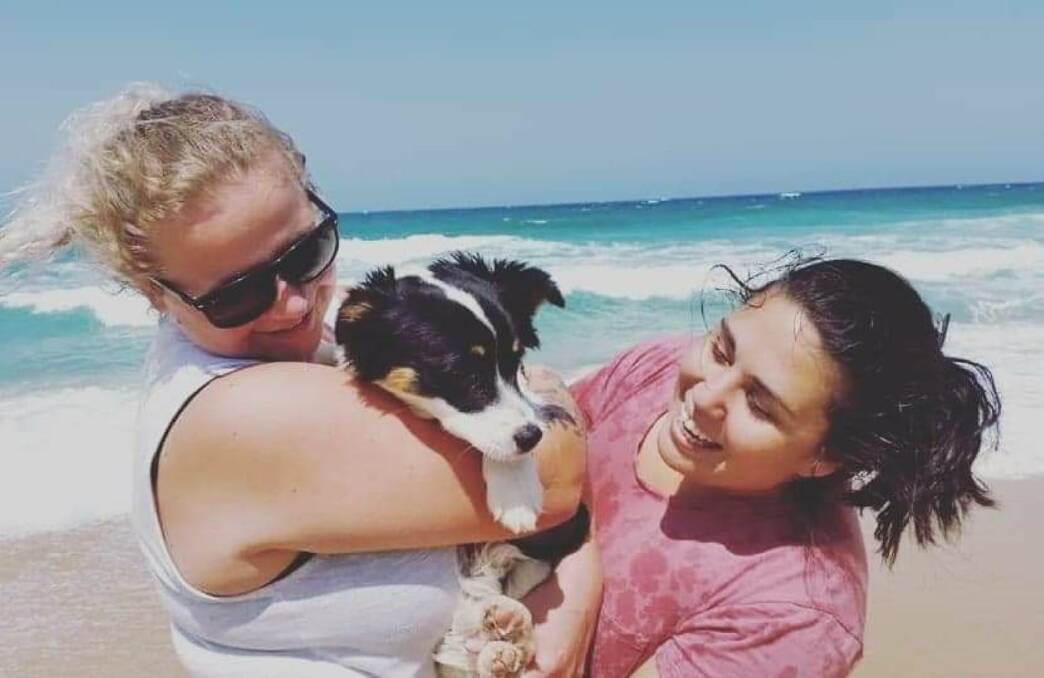 MOVING: Ashlee and Lisa Morgan with one of their fur babies, Lilly, who will be moving to Tasmania with them. Picture: Supplied