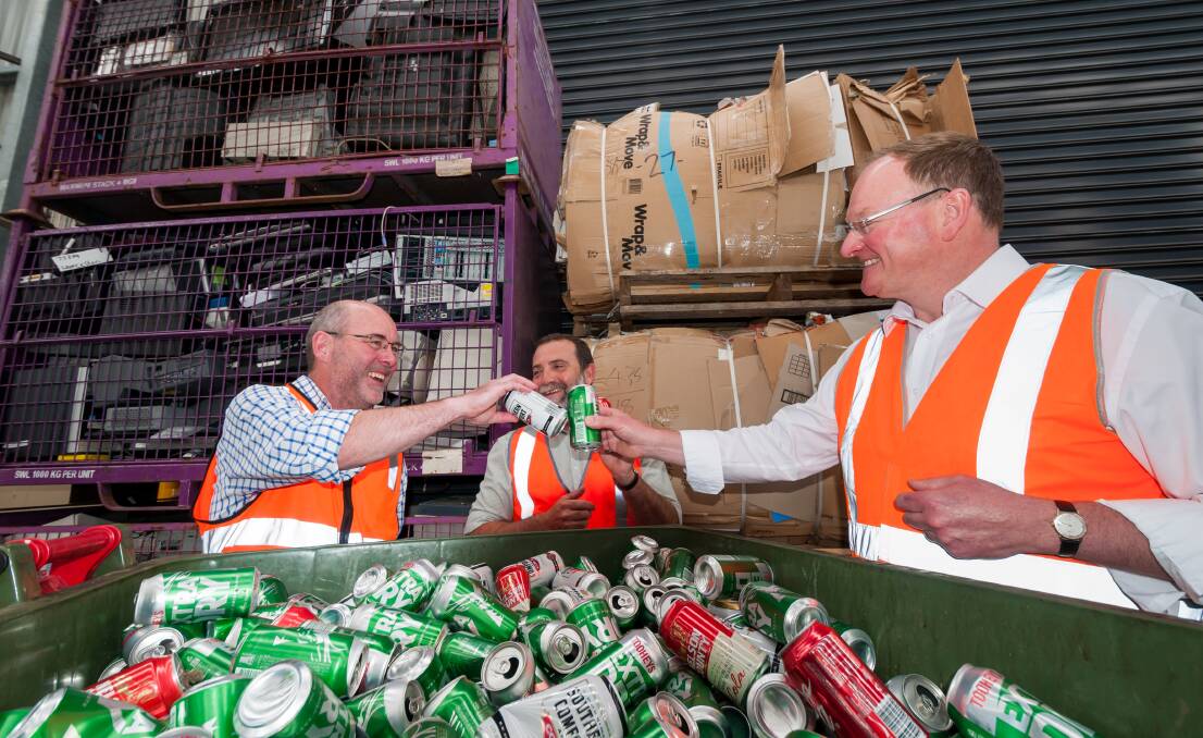 CHEERS: Charitable Recycling Australia Tasmanian director Peter Freak, City of Launceston sustainability team leader Mike Attard and Environment Minister Roger Jaensch discuss the container deposit scheme. Picture: Phillip Biggs