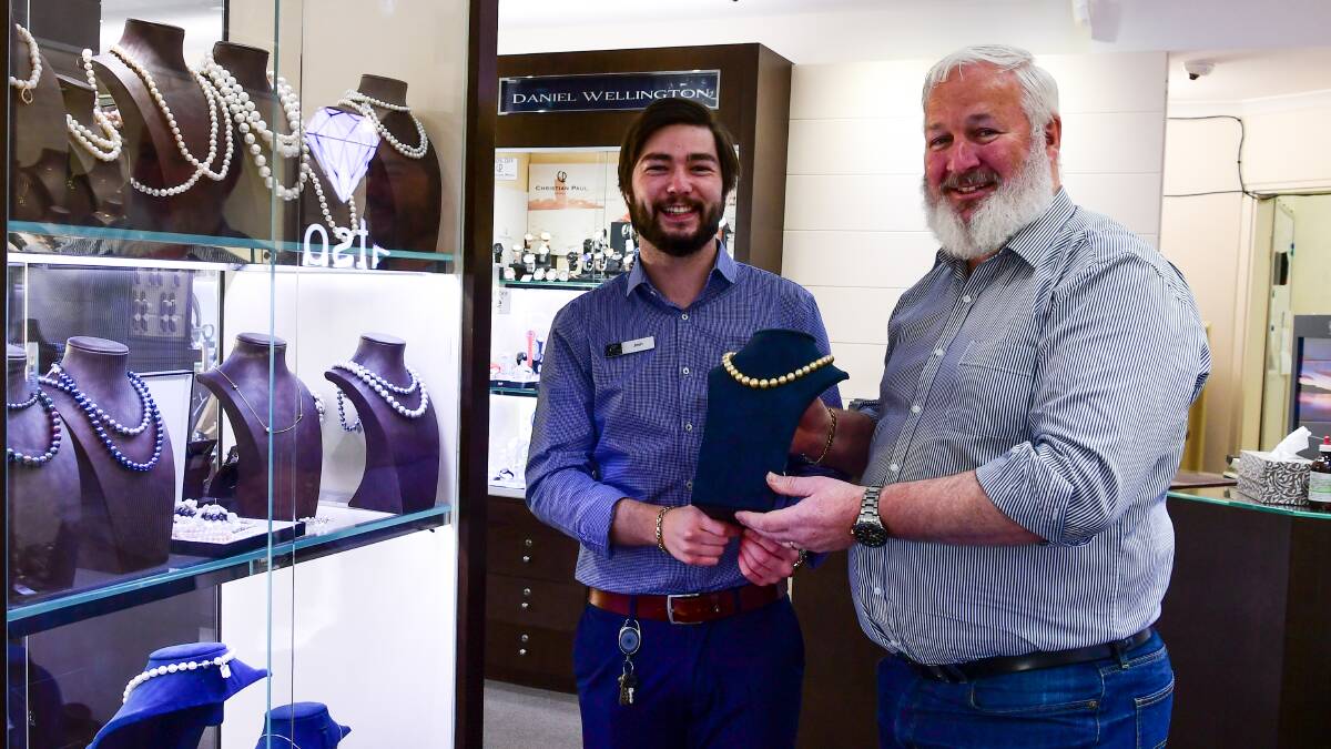 FAR LEFT: Josh Watson with his dad Neil at the family jewellers on Brisbane Street. Picture: Neil Richardson