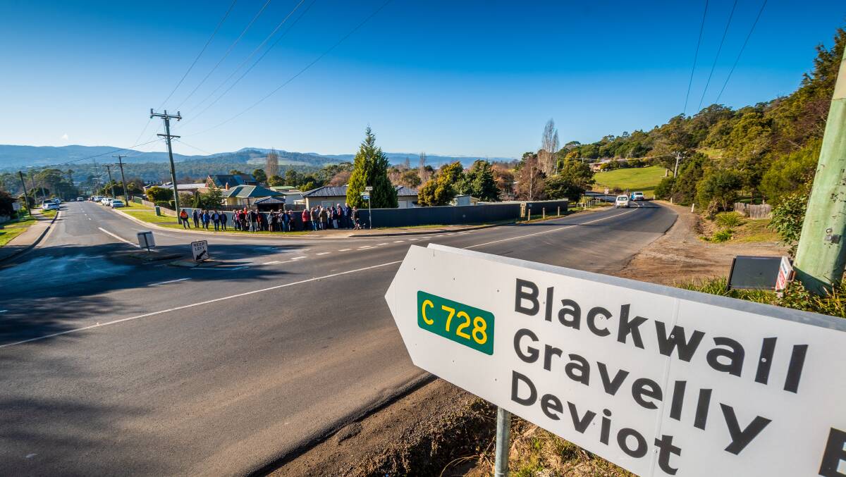 RETHINK: Residents gathered at the turn off from Gravelly Beach Road earlier this month where they want a roundabout built. Picture: Phillip Biggs