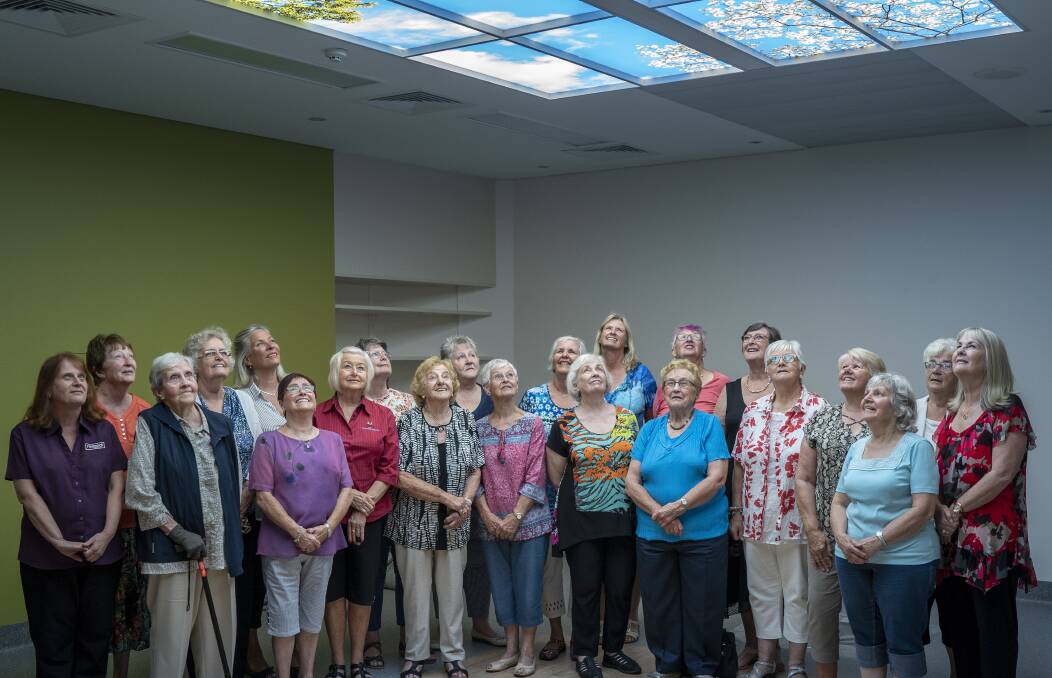 LOOKING UP: Members of the Holman Clinic and Cancer Ward Auxiliary under a sky ceiling in the refurbished radiation treatment room. Picture: Rob Burnett 