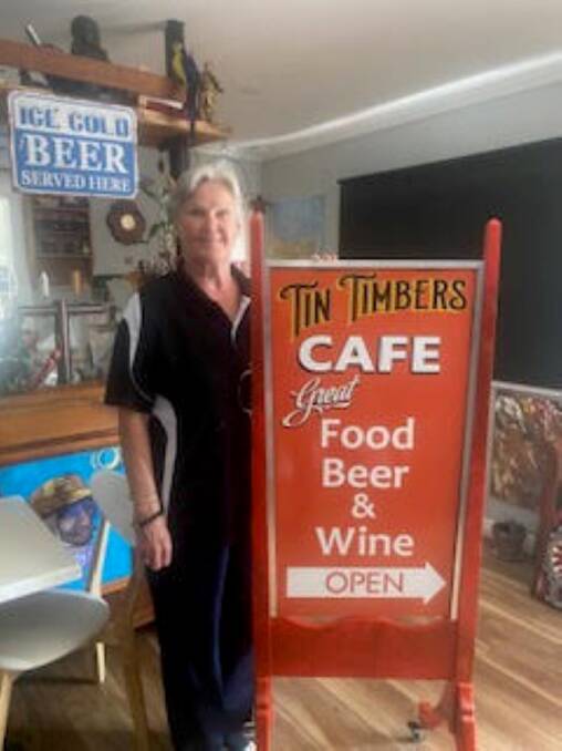 Tin Timbers café owner Angelina Hemphill with the remade sign. 