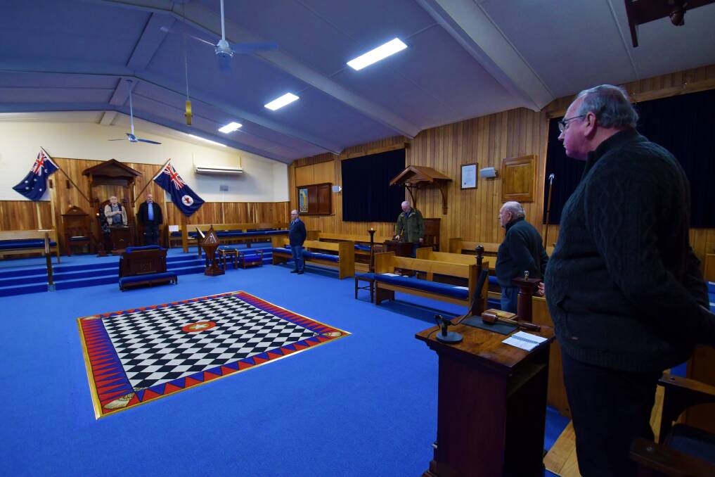 CEREMONY: North-West Freemasons stand while rehearsing the opening and closing of a lodge meeting. Picture: Brodie Weeding