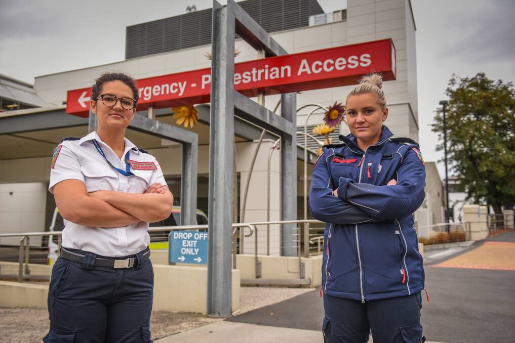 STAY HOME: Paramedics Natalie Koning and Sydney Pitt want people to help them save lives by staying home and following social distancing measures. Picture: Paul Scambler.