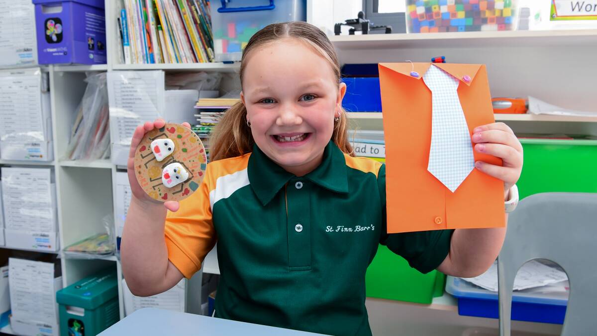 Ruby Dale with the card and present she made for her dad in class. Picture: Neil Richardson