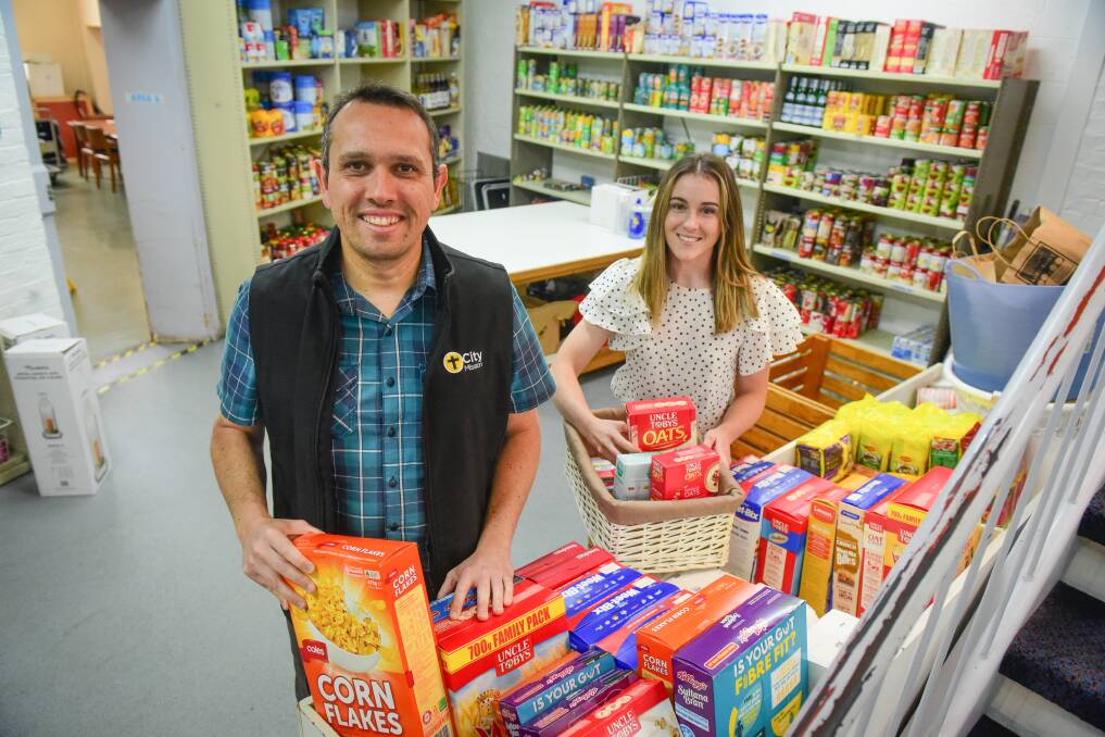 SUPPORT: City Mission Launceston's marketing and fundraiser manager Rafael Demarchi with marketing and fundraising co-ordinator Shaziye Parish at the food bank at the Launceston City Mission .Picture: Paul Scambler