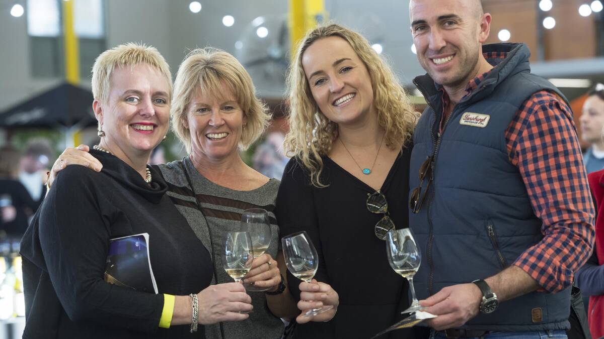 Tasting, tasting, tasting … a quartet enjoy working their way through winning entries in the Sydney Royal Wine Show. 