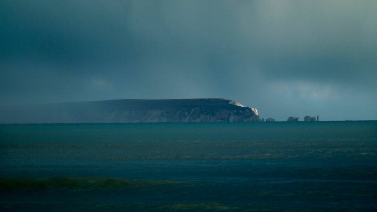 Isle of Wight, off the south coast of England, cuts an eerie shadow