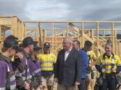 PROGRAM PRAISED: Prime Minister Scott Morrison with Mead Con apprentices and Braddon Federal MP Gavin Pearce at a site at Spreyton. Picture: Claudia Williams 
