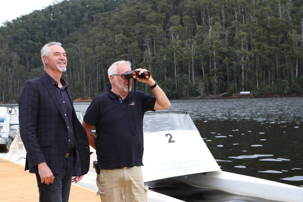 MONSTER SIGHTING: Kentish Mayor Tim Wilson and Rowing Tasmania executive officer Robert Prescott searching for the ``beast''.
