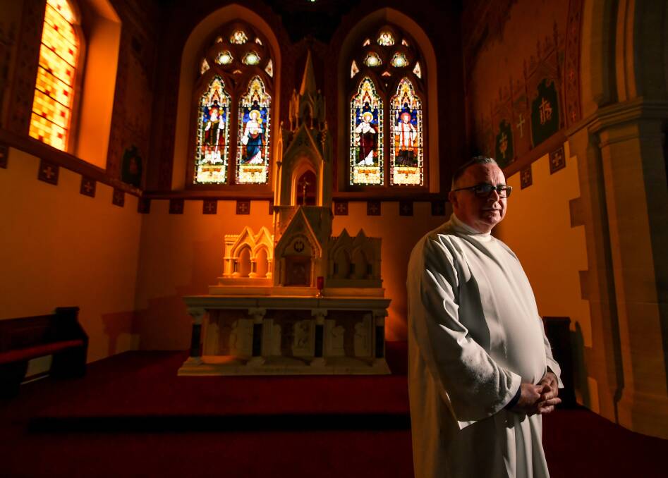 VIRTUAL OUTLOOK: Parish priest Father Mark Freeman inside Church of the Apostles looks to the future as the government shuts down churches. Picture: Scott Gelston.