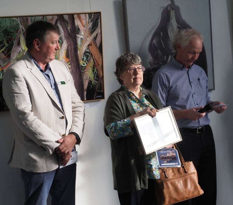 WINNER: Mayor Wayne Johnston, major prize winner Judy Nelson and the council's event organiser and MC Patrick Gambles. Picture: Bruce Hutchins.