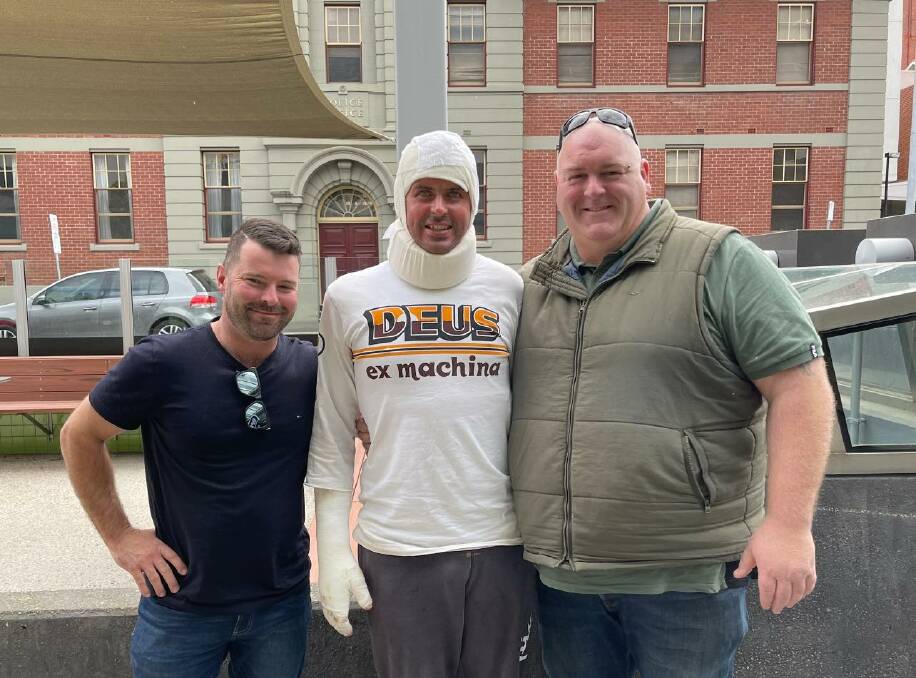 HOPE: Adams Distillery owners Adam Saunders and Adam Pinkard with employee Greg Longmore, who suffered burns to about 40 per cent of his body last month. Picture: supplied.