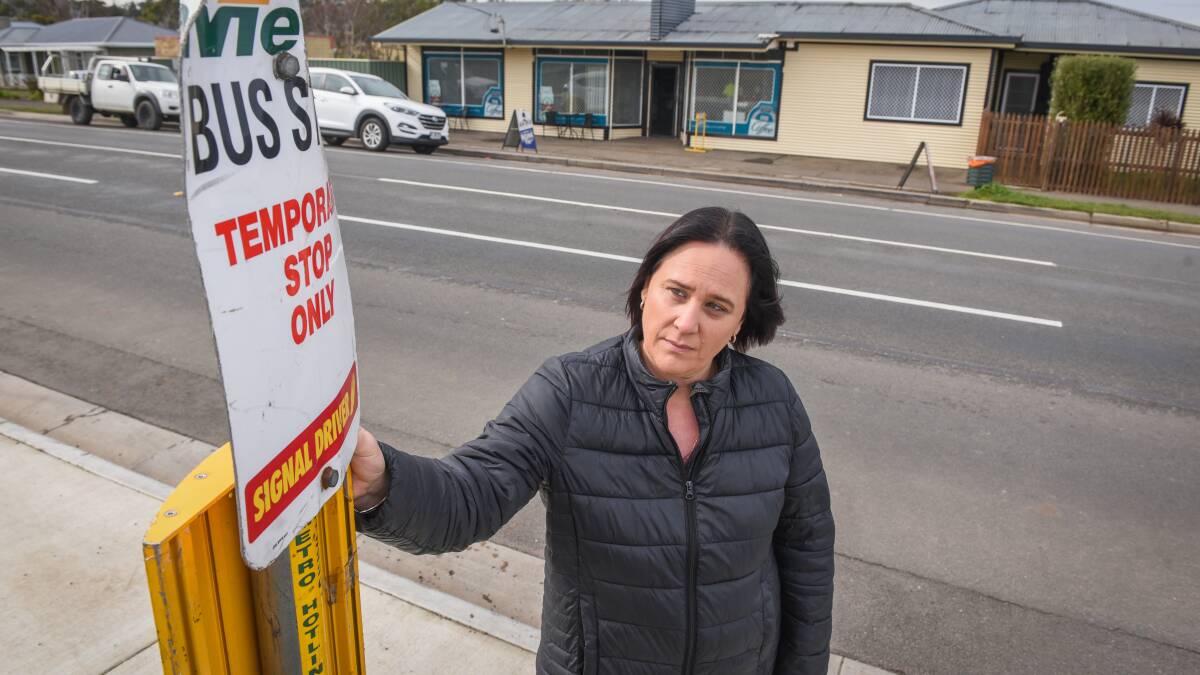 SAFETY CONCERNS: Spider's North owner Kylie Evans with the temporary bus stop moved from further down the road, where there was an inlet for buses to pull in, to opposite her shop with no inlet. Picture: Paul Scambler.