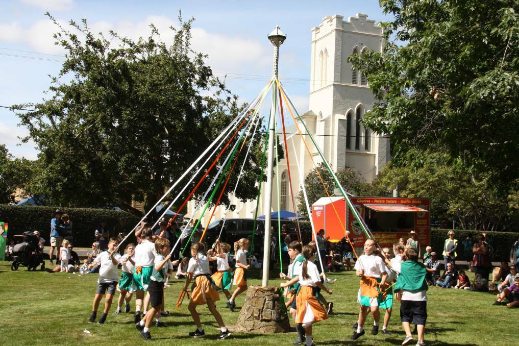 FESTIVAL: Children enjoy traditional maypole dancing at Westbury.