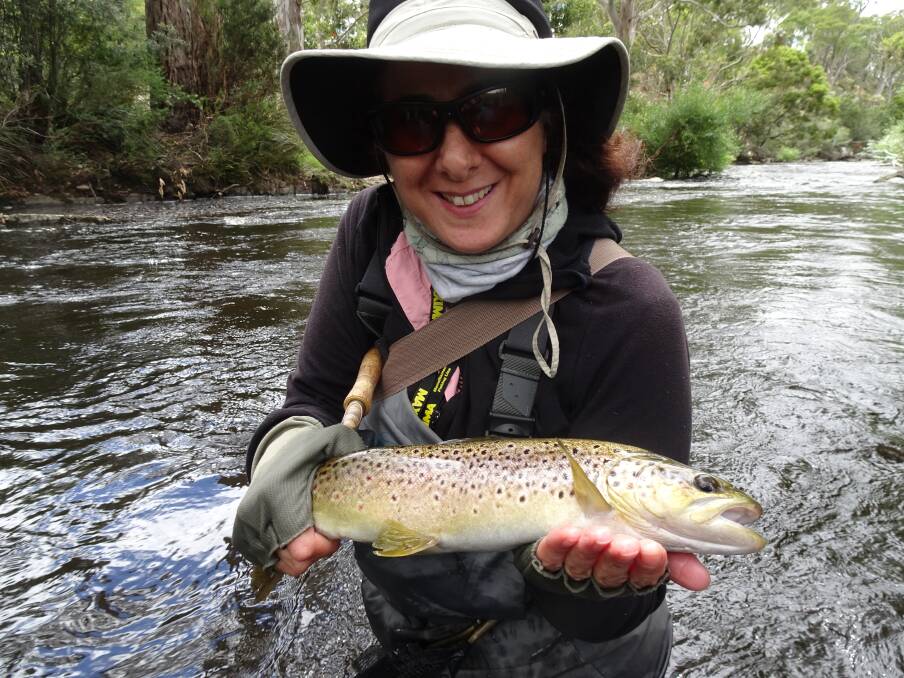 GREAT TIE IN: Anna Bellette holding a brown trout she caught on the Tyenna River with one of her ties. Picture supplied.