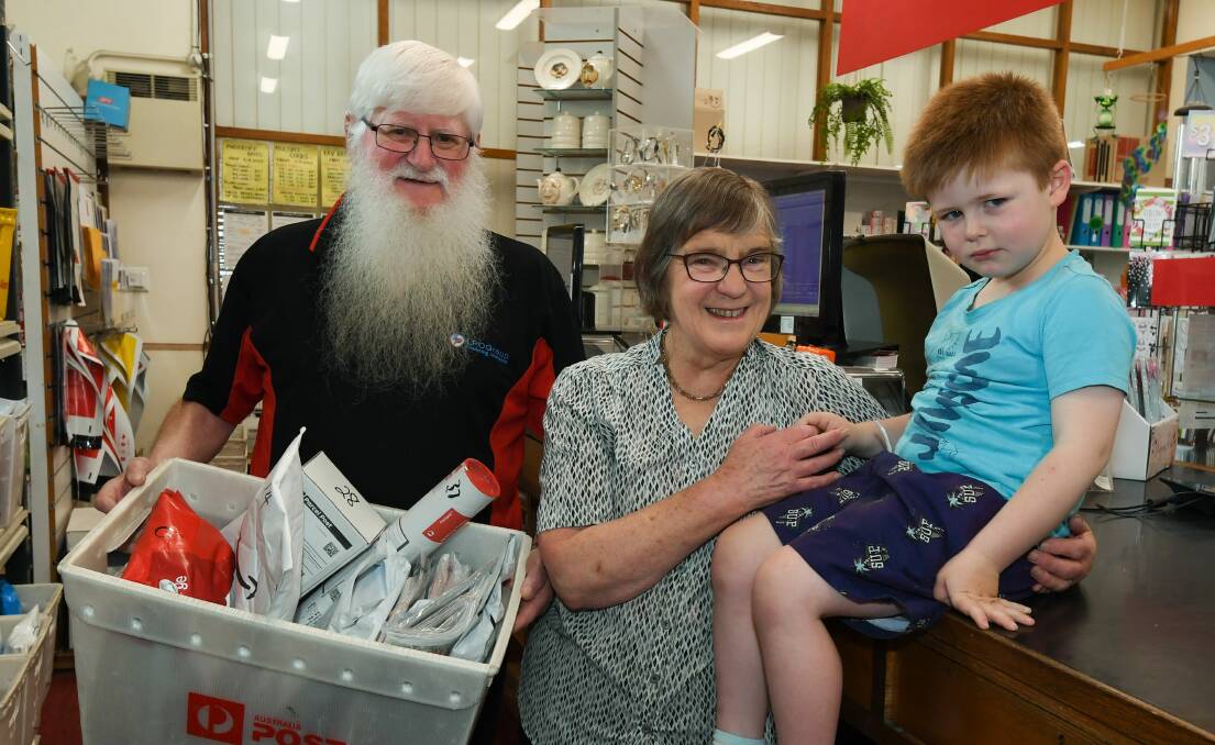 LOVE: Westbury Post Office's Bob and Cheryl Richardson celebrate 50 years of marriage with their grandson Ryan. Picture: Neil Richardson.