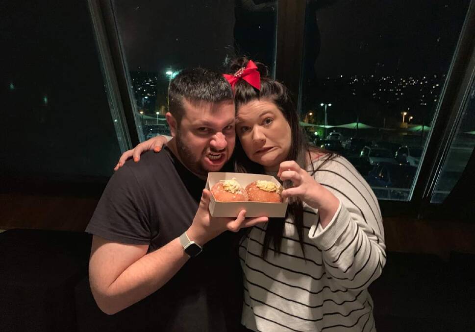 TRIAL RUN: Comedians Christian Hull and Tanya Hennessy at their September 'Low Expectations Tour' show in Hobart trialed the Caramilk donuts. Image supplied.