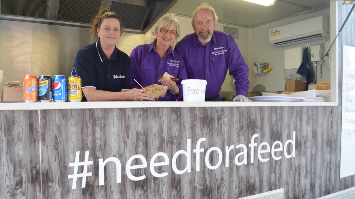 EXPO: Kirsten Ritchie, Julie Young and Ross Duniam inside charity food truck Launceston Feeding the Homeless. Picture: Isobel Cootes