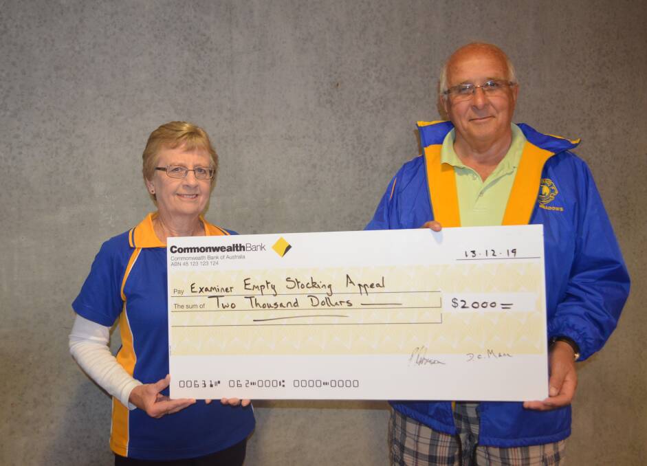 HELPING HAND: Kings Meadows Lions Club secretary June Pearton and president Dennis Mann present the cheque to the appeal. 