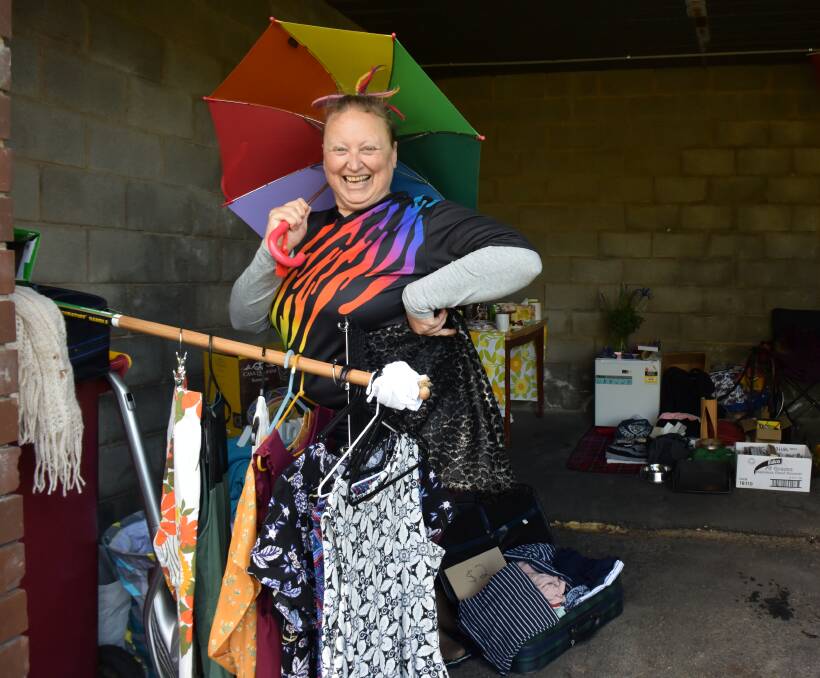 GARAGE SALE: Di Anderson shows off what was on offer at Diversity Launceston's stall for the Garage Sale Trail. Picture: Isobel Cootes.