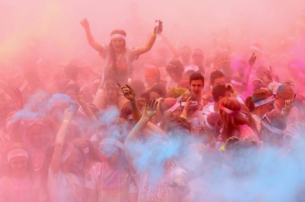 Competitors run through the colour stations during a colour run in Melbourne. Picture: Quinn Rooney/Getty Images