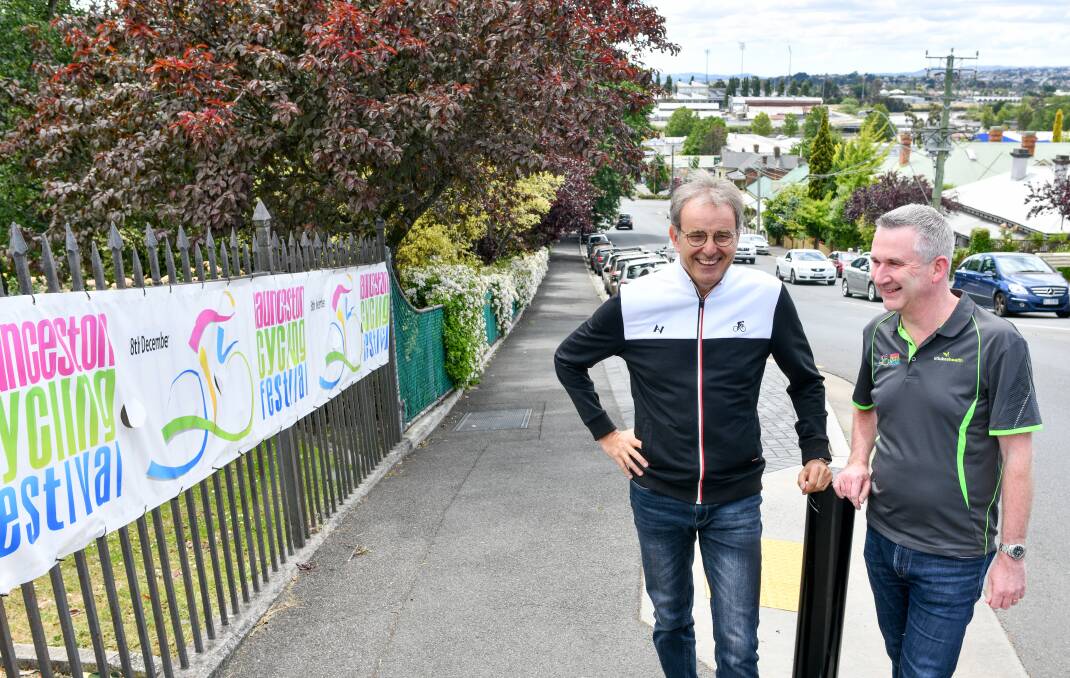 CYCLING MEETS TOURISM: Launceston Cycling Festival's commentator Mike Tomalaris and event director Rick Fontyn by the start line at the top of Lawrence Street's hill, on Brisbane Street. Picture: Scott Gelston.
