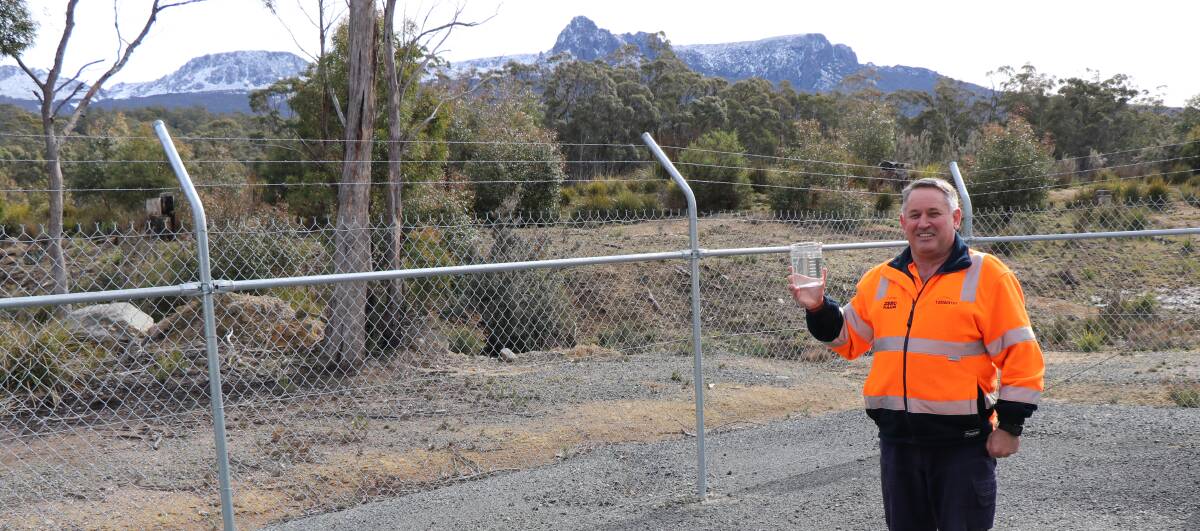 WINNER: TasWater central north coordinator Damien Lavelle with a sample of water at the Rossarden Water Treatment Plant. Picture: supplied.