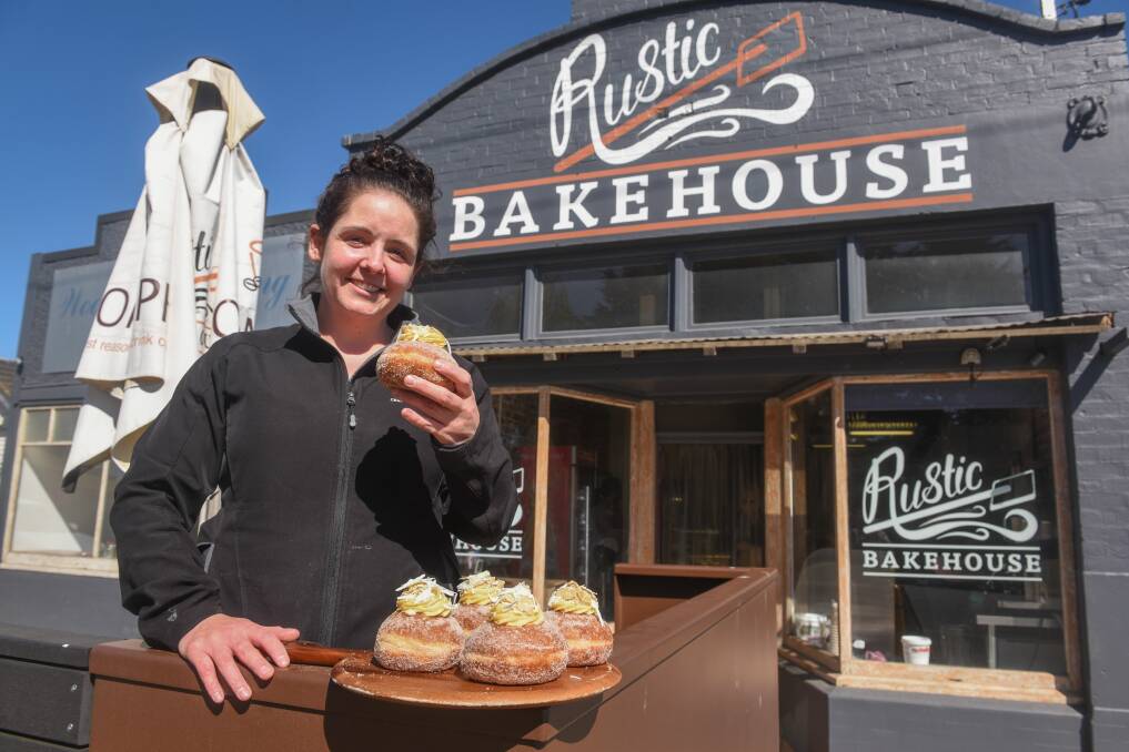 AUSSIE FIRST: Rustic Bakehouse owner Katie Lamprey with Australia's first Caramilk donuts, and she has the Facebook receipts to prove it. Picture: Paul Scambler.