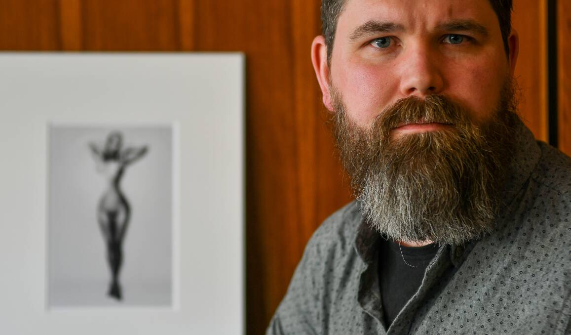 Seriously good: Launceston's Bruce Moyle with his award winning print, Imperfect Perfect. Picture: Scott Gelston.