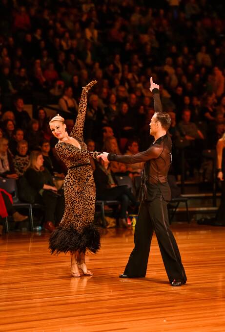 Red hot: Victorian dancers Danielle Devine and Dean Anderson take to the floor in the masters open Latin final during the Tasmanian Dancesport Championships at the Silverdone. Picture: Scott Gelston.