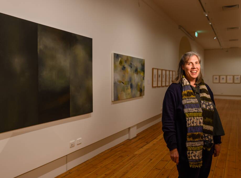 VIEWING: Bridget Arkless in Robyn McKinnon's exhibition, Disappearing into Being.
Pictures: Scott Gelston.