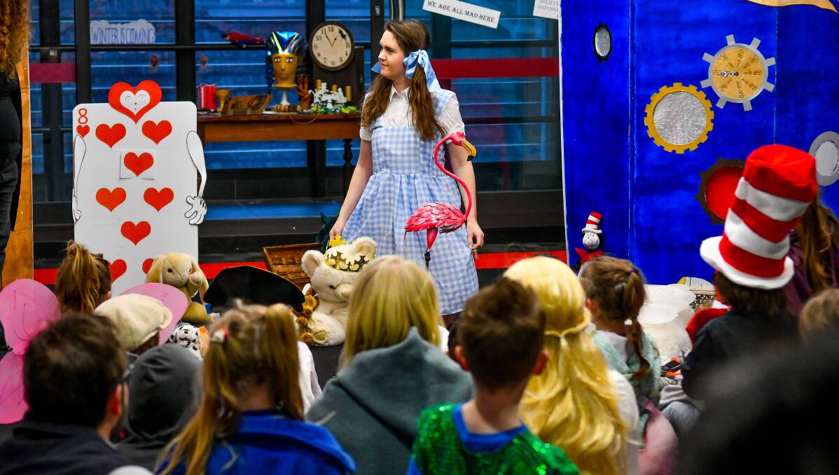 Wonderland: Launceston Library's Alice Imlach entertains the audience during their Find Your Treasure book week event. Picture: Scott Gelston.