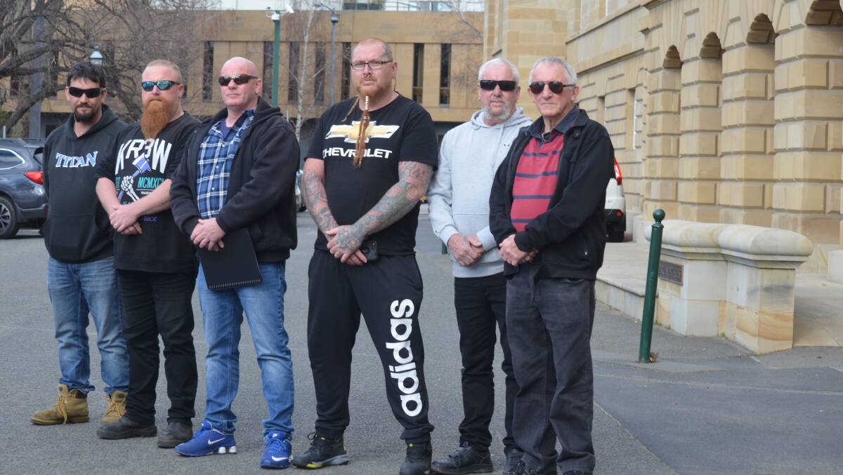 Rebels Motorcycle Club state president Shaun Kelly (third from left) attended state Parliament on Thursday with fellow club members.