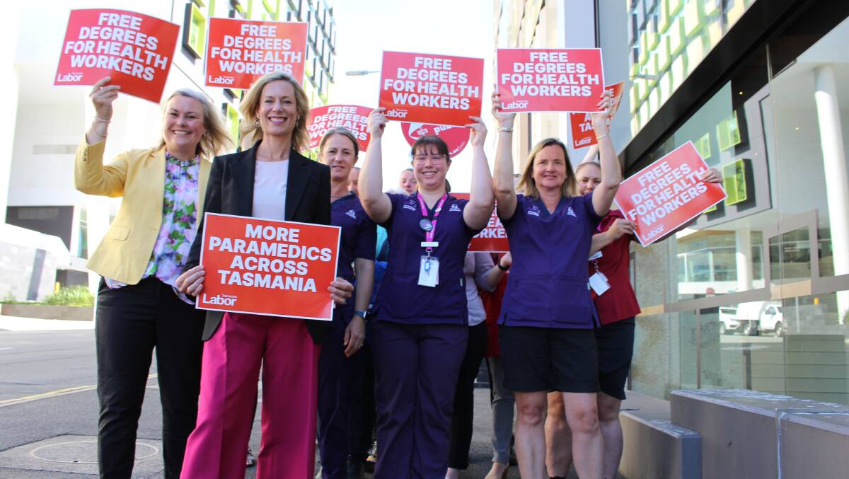 Labor's health spokeswoman Anita Dow and party leader Rebecca White with health workers promoting free degrees for nurses, midwives, allied health workers and paramedics.