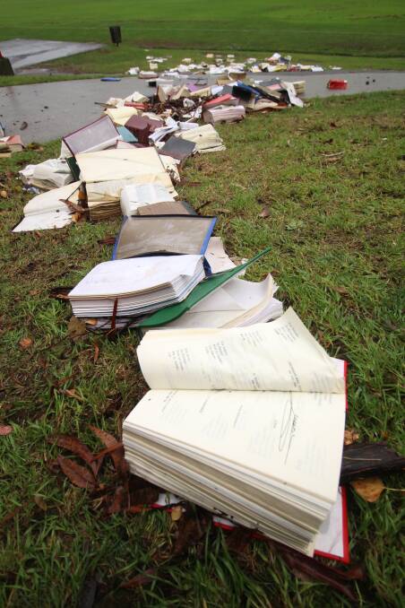 Law texts strewn across the lawn's at the University of Tasmania's Sandy Bay campus.